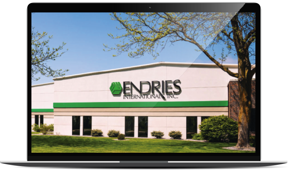 Laptop displaying an image of a building with the Endries logo