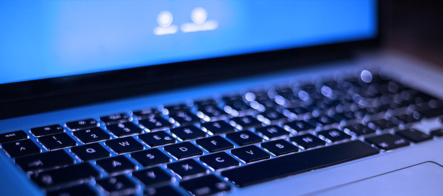 Mac laptop with Facebook open.