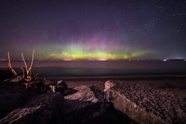 The Northern Lights illuminate the sky above a county park.