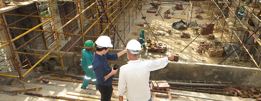 Two construction workers going over plans.